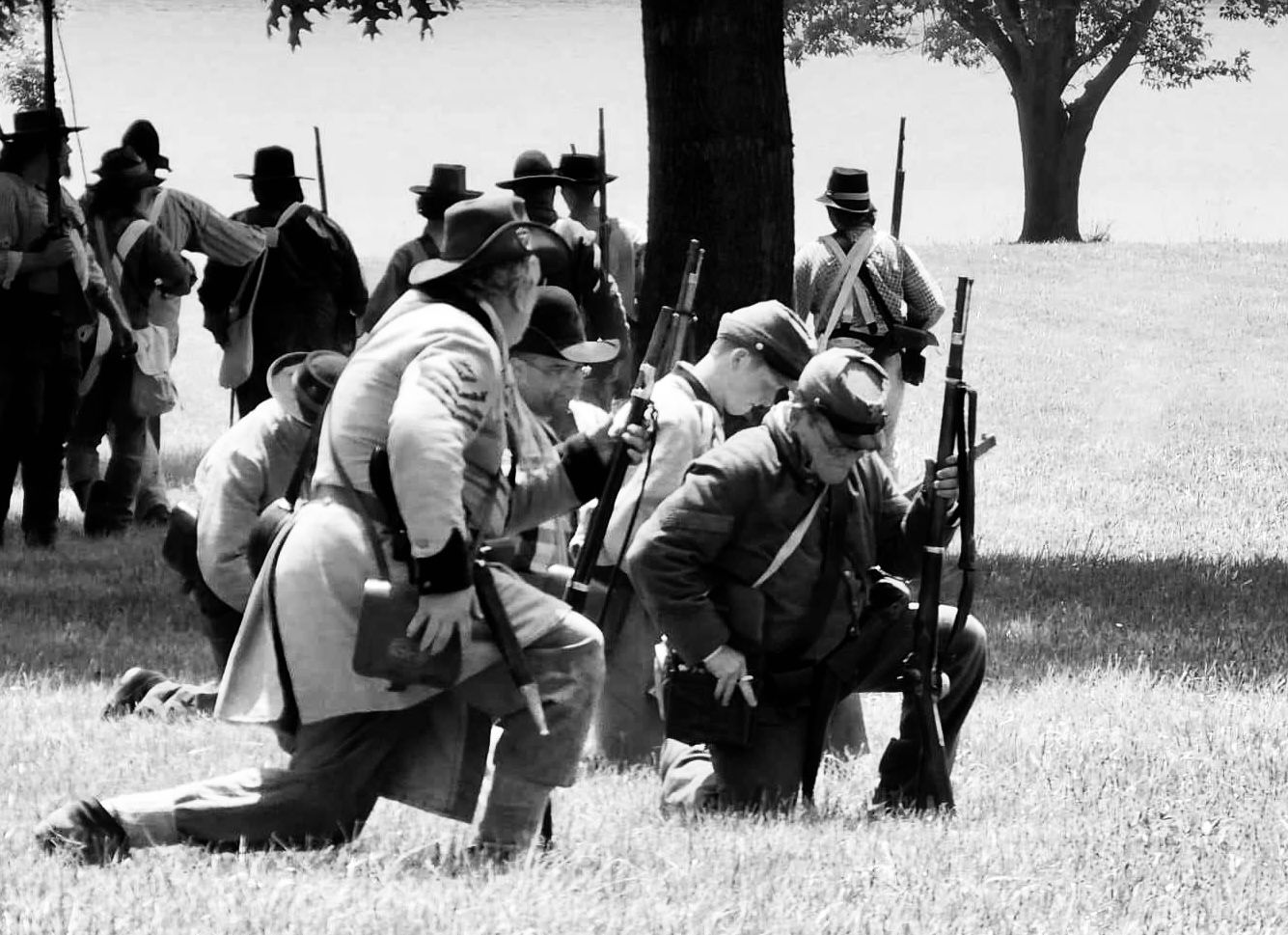 Soldiers kneeling during war reenactment