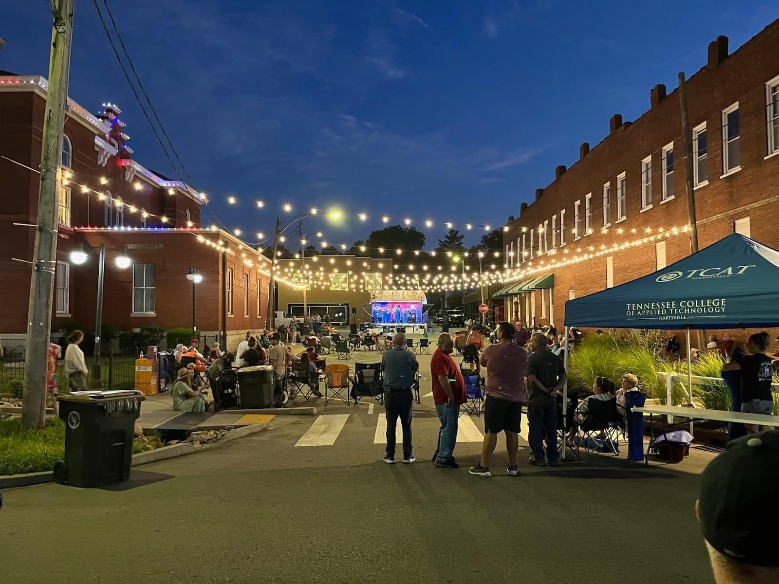 Downtown Sound during evening, overhead lights, with vendor